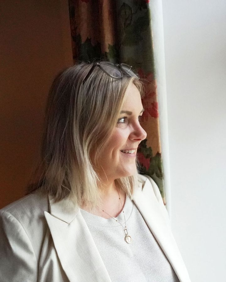 Jasmine-smiling-by-window