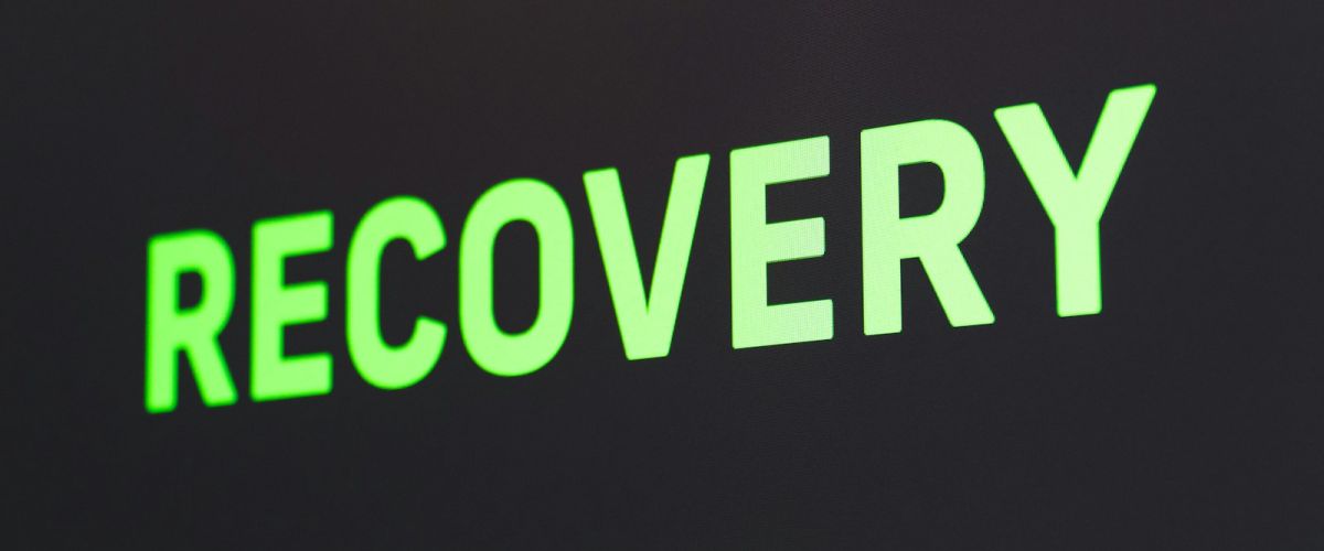 a close up of a sign that reads recovery